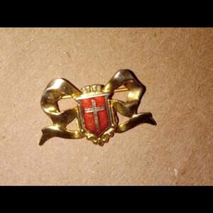 Vintage Red Shield Christian Crucifix On A Bow Lapel/Hat Pin Gold Tone. Award